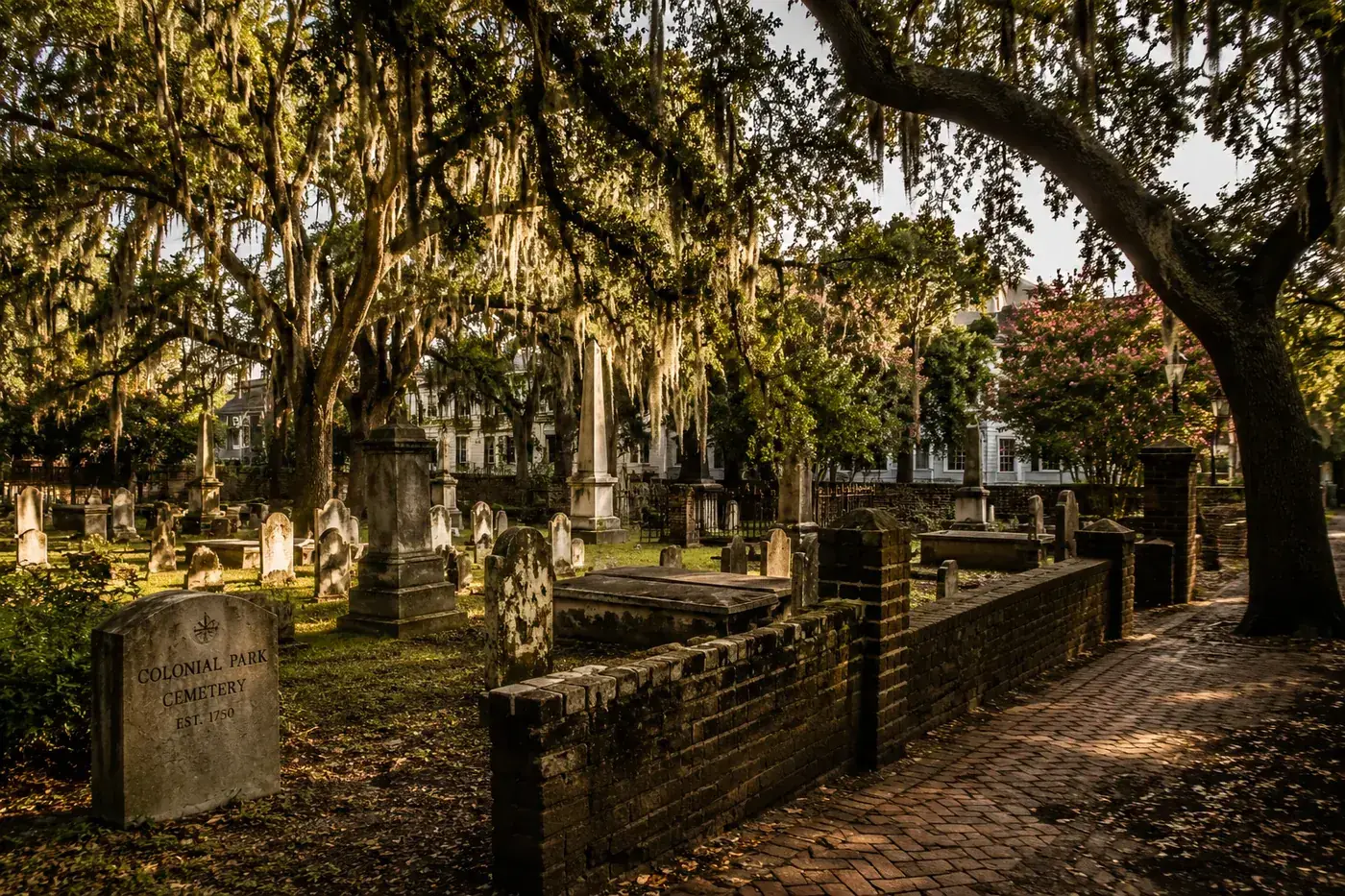 Historic gravestones beneath live oaks in Savannah's Colonial Park Cemetery.